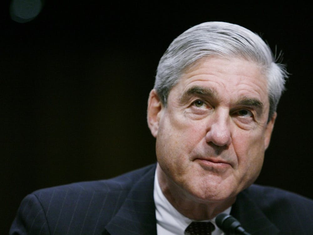Robert Mueller testifies before a Senate Intelligence Committee hearing in February 2011 in Washington, D.C. Attorney General William Barr told Congress on Sunday that special counsel Robert Mueller did not find that Donald Trump&#x27;s presidential campaign &quot;or anyone associated with it conspired or coordinated with Russia&quot; in 2016.