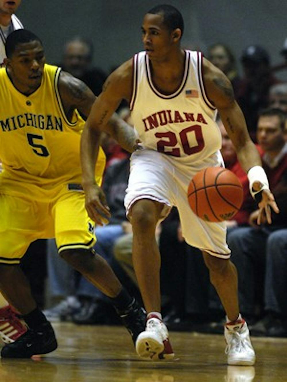 IDS File Photo
Junior guard A.J. Ratliff drives past Dion Harris during the second half of the IU victory over Michigan Saturday, Jan. 27, 2007 at Assembly Hall.  Ratliff scored nine points off the bench for the Hoosiers.