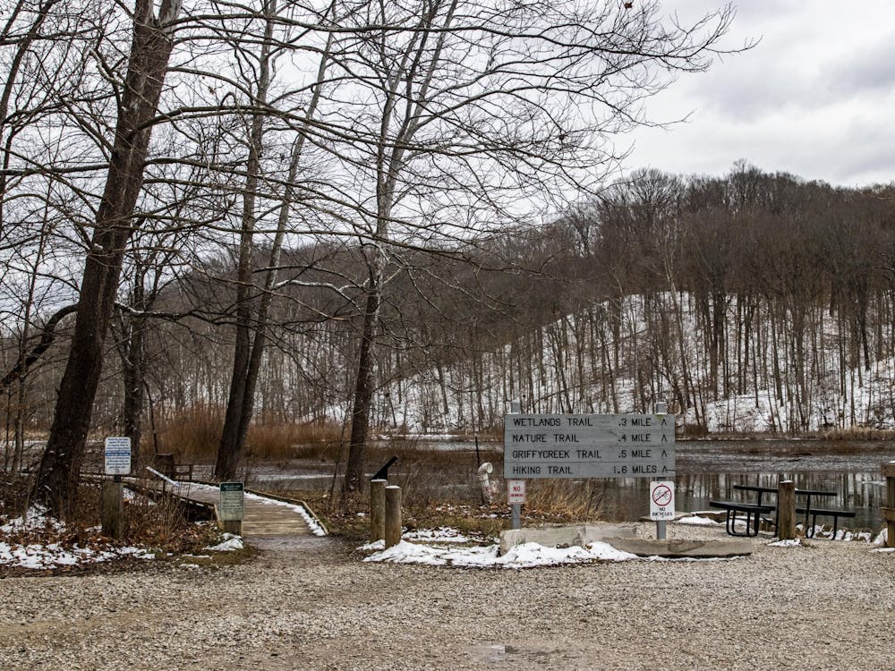 A trail sign is seen in front of the waterfront Feb. 2, 2021, at Griffy Lake Nature Preserve. The Bloomington Parks and Recreation Department will conduct a 5.5 acre controlled burn Nov. 9.