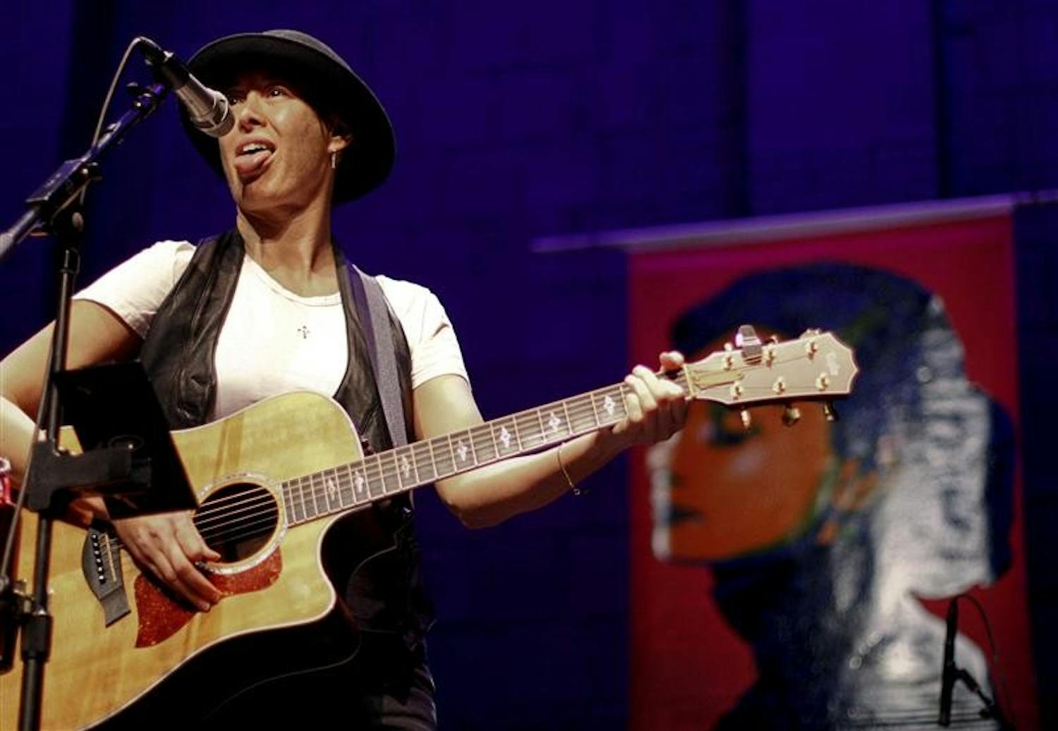 Michelle Shocked performs Saturday evening at the Buskirk Chumley Theater. Shoked's stage featured a painting of Audrey Hepburn in the background. and in between songs called the painter to talk to him about it, but got his voice mail the first time.