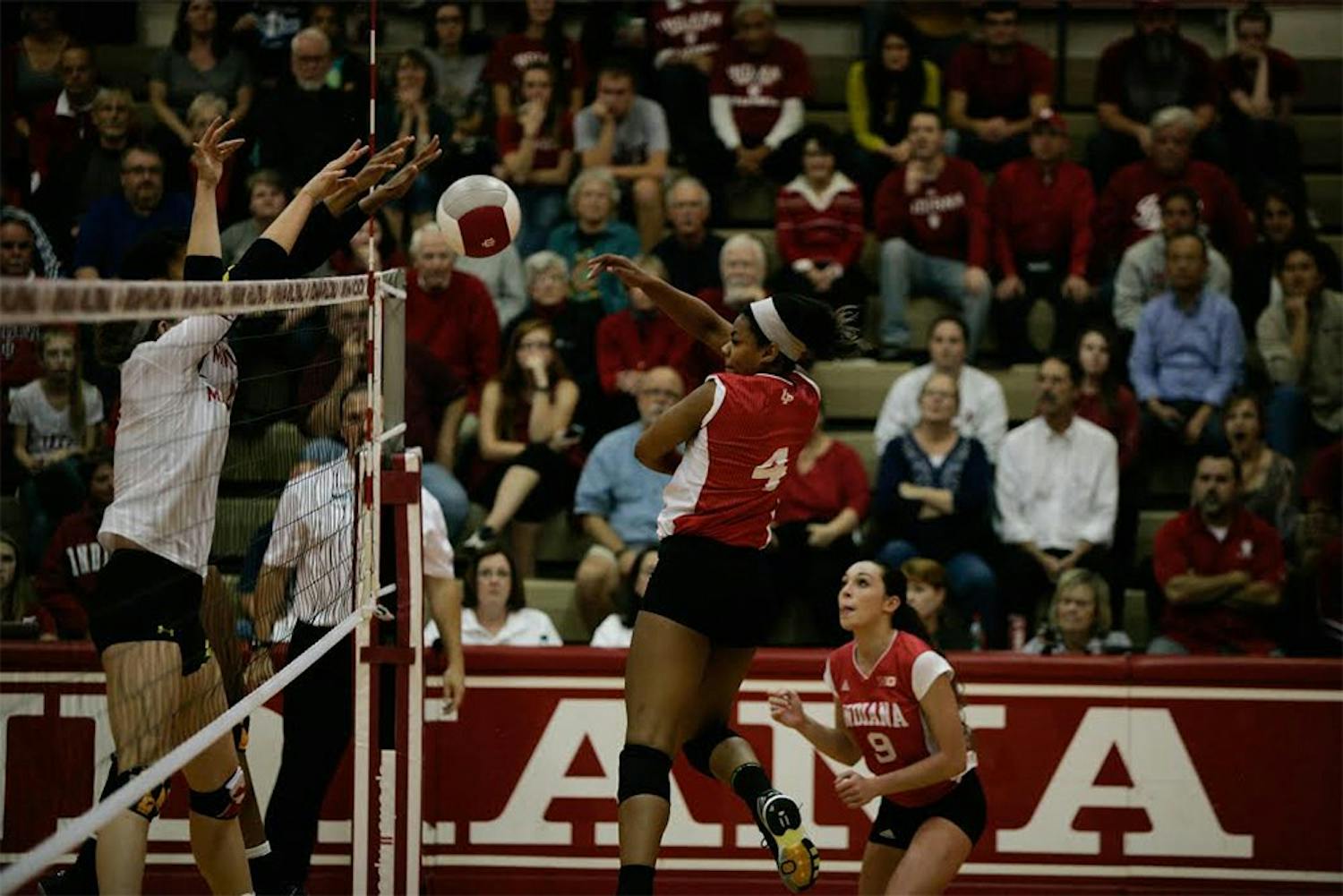Redshirt senior Chanté George spikes the ball during a game against Maryland on Friday night. The Hoosiers won 3-1.
