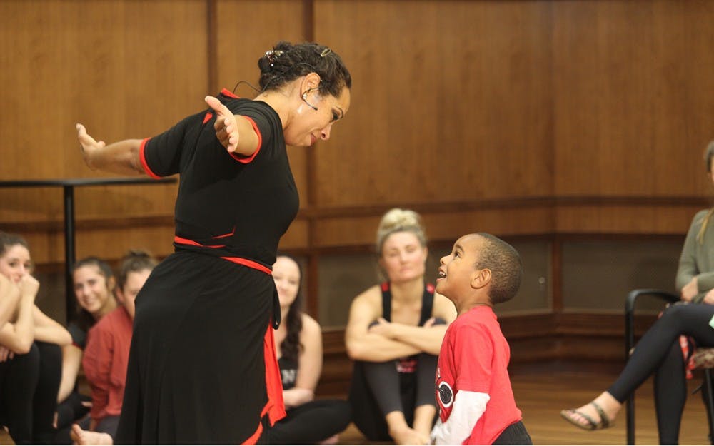 Dancer, Nyama McCarthy-Brown, and her son Kasim McCarthy-Brown do a dance performance together during the Embodied Conversations on Racism program Tuesday at Franklin Hall. The piece discribes how young African American boys should be protected and taught at a young age the facts of their future lives. 