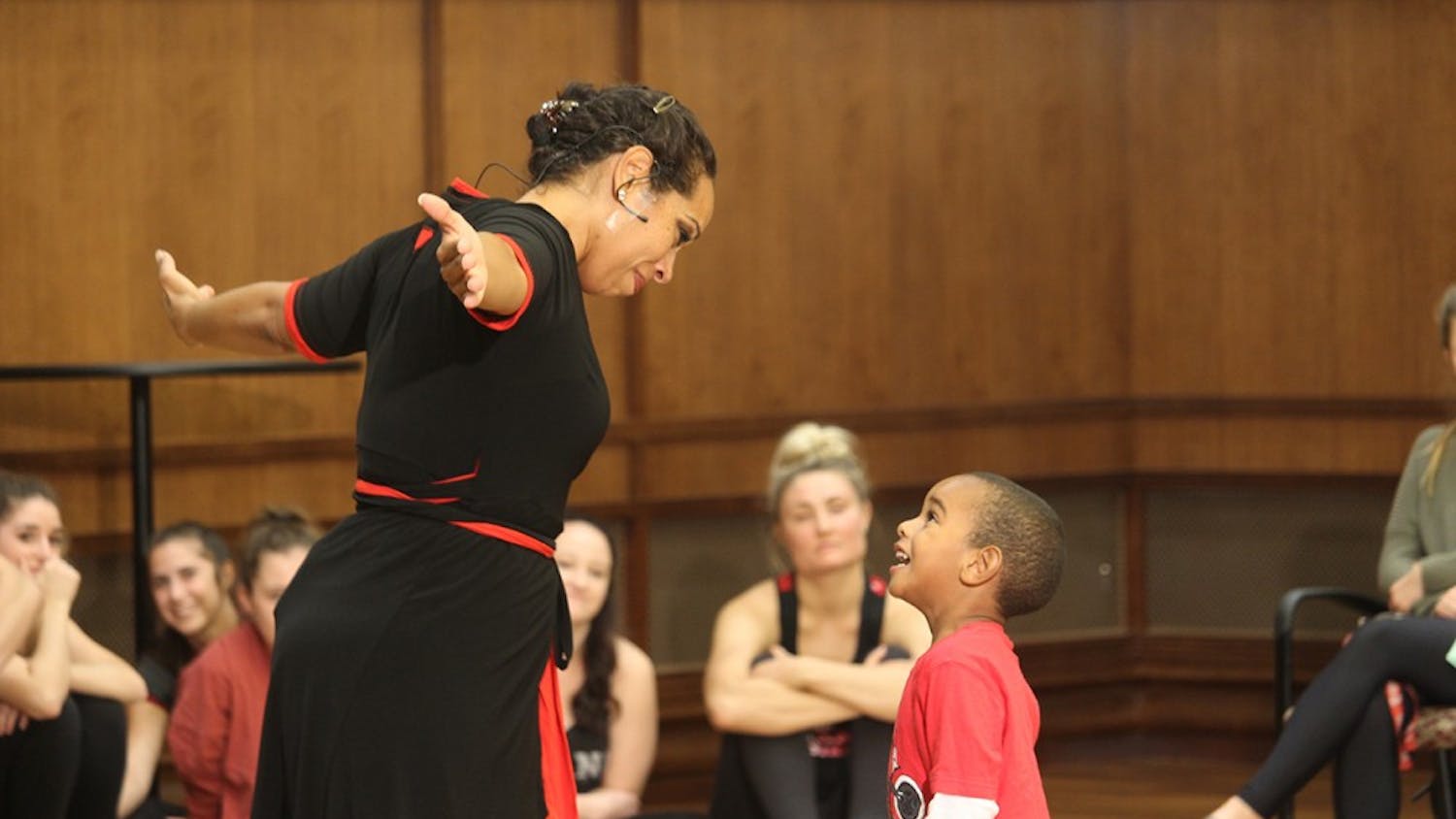 Dancer, Nyama McCarthy-Brown, and her son Kasim McCarthy-Brown do a dance performance together during the Embodied Conversations on Racism program Tuesday at Franklin Hall. The piece discribes how young African American boys should be protected and taught at a young age the facts of their future lives. 