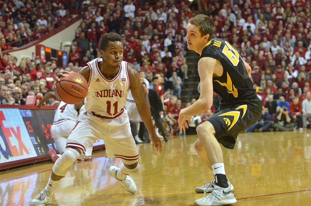 Senior guard Kevin "Yogi" Ferrell looks for an opening in the Iowa defense. Ferrell led in scoring against the Hawkeyes, putting up 14 points to help the Hoosiers win 85-78 Thursday at Assembly Hall. 