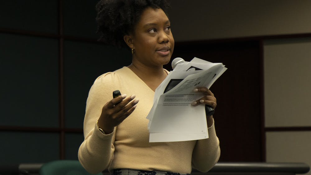 Postdoctoral fellow Tennisha Riley discusses mental health during the State of the Black Community address Feb. 4 at City Hall. Riley discussed how teen suicide among young people of color is rising. 