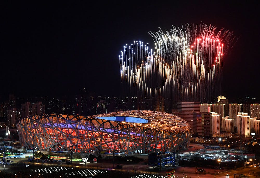 <p>Fireworks in the shape of the Olympic rings go off Feb. 4, 2022, over the National Stadium during the opening ceremony of the Beijing 2022 Winter Olympic Games. Ellia Green, now the first Olympian to come out as a transgender man, appeared in the opening video shown at the Bingham Cup Summit addressing what it&#x27;s like to be a transgender athlete.</p>