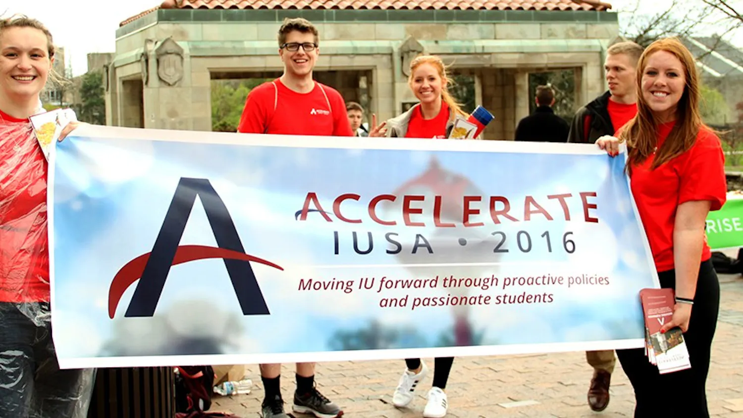 Amy Scobey, left, member of the Accelerate, and Stephanie Chinn, chief of marketing of the Accelerate, hold up a banner for the 2016 IUSA Election on Wednesday. The election will run from April 6 at 10 AM through April 7 at 10 PM.