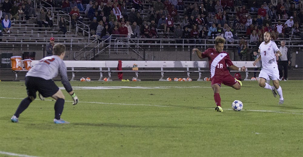 Rees Wedderburn takes a shot during the first half of game play against Ohi State on Saturday at Jerry Yeagley Field. The shot bounced off both goal posts before going out of bounds.