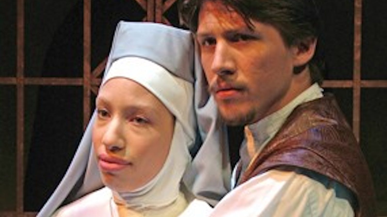 Courtesy photo
Harper Jones as Claudio embraces Dawn Thomas as Isabelle in Shakespeare's MEASURE FOR MEASURE presented by the IU Department of Theatre and Drama in the Ruth N. Halls Theatre.