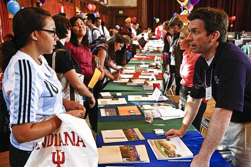 Sophomore Mariela Colindres speaks to Craig Jorgensen of Ave Maria School of Law Class of 2008 Monday afternoon in Alumni Hall. Jorgensen was here as part of the law fair, featuring law school representatives from across the country.