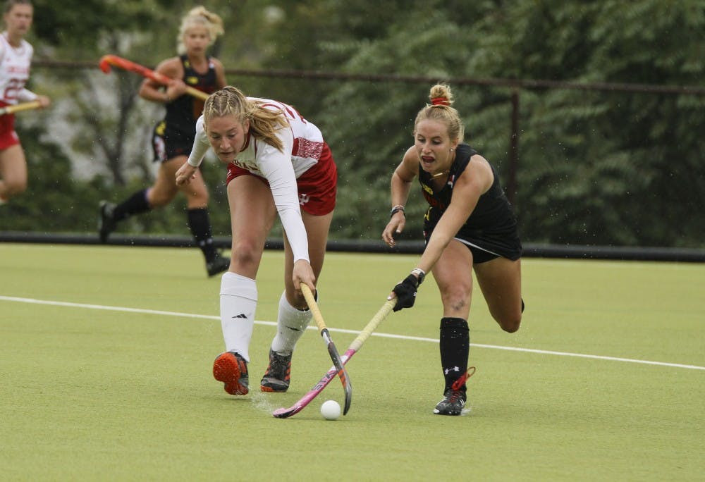 <p>Now-junior forward Bente Buwalda fights for the ball against Maryland&#x27;s Kyler Greenwalt on Oct. 12 at the IU Field Hockey Complex. The team picked up its first win of the season, 4-3, against Drexel University behind a double-overtime game-winner from senior forward Sheridan Weiss.</p>