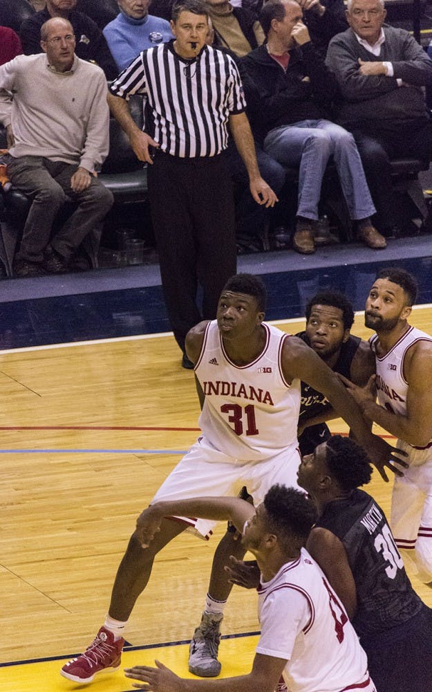 Indiana's Thomas Bryant boxes out during Saturday afternoon's Cross Roads Classic loss to Butler at Bankers Life Fieldhouse.