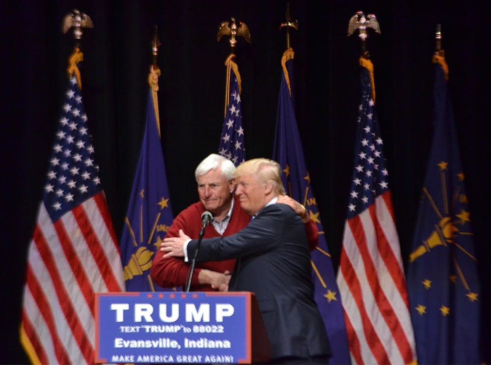 Former Indiana University basketball coach Bobby Knight embraces presidential candidate Donald Trump at a rally in Evansville, Indiana on Wednesday.