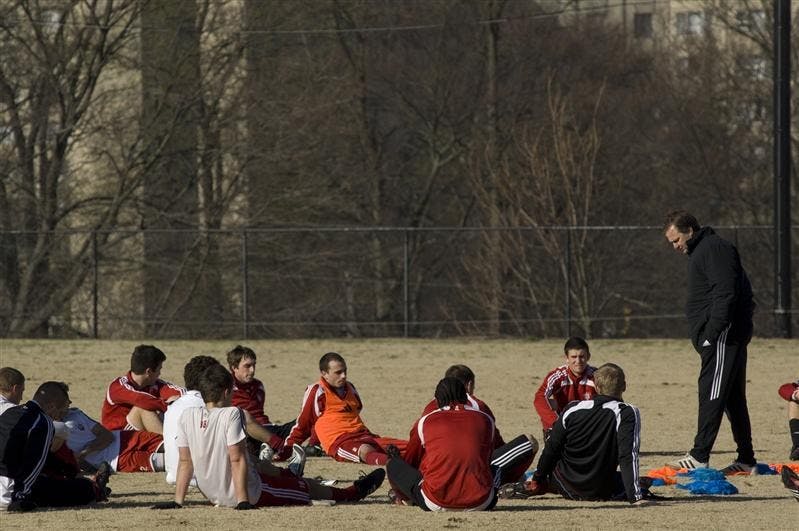 IU men's soccer coach Mike Freitag talks to players after practice Wednesday morning at practice. IU will play Louisville today at 7 p.m.
