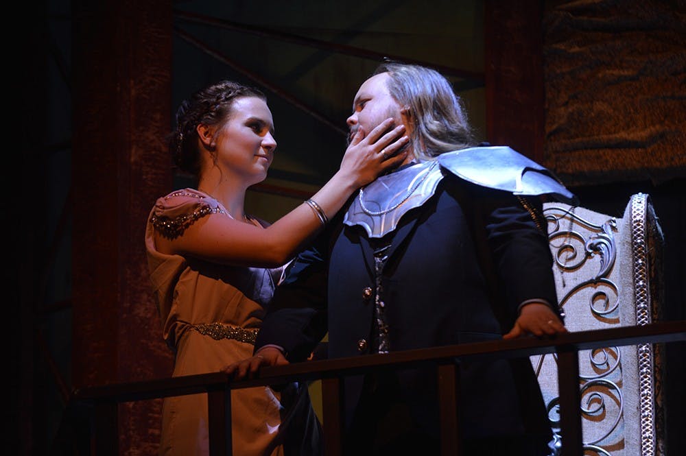 Junior Bailey Praeger and first-year M.F.A student Justino Brokaw perform as their characters Eurydice and Creon of the Greek tragedy "Antigone" during the show's rehearsal Monday evening at the Wells-Metz Theatre. The show's first performance will be Friday at 7:30 p.m. at the Wells-Metz Theatre.