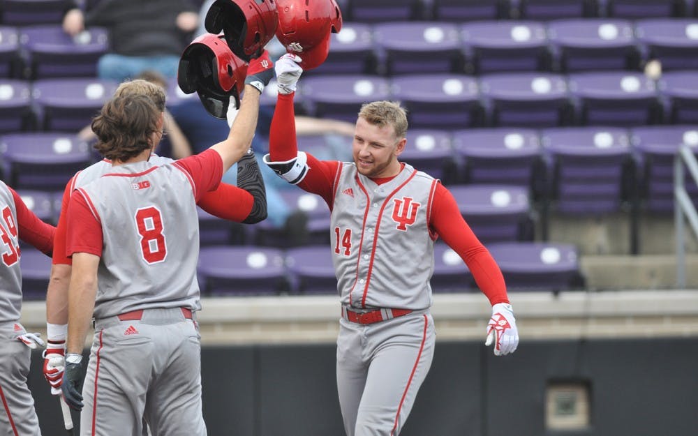 Sophomore Matt LLoyd is congratulated by his teammates at home plate after a 3-run home run in the first inning of Game 2 Saturday at Rocky and Bernice Miller Park. Matt Lloyd hit 4 home runs over the course of two games on Saturday.