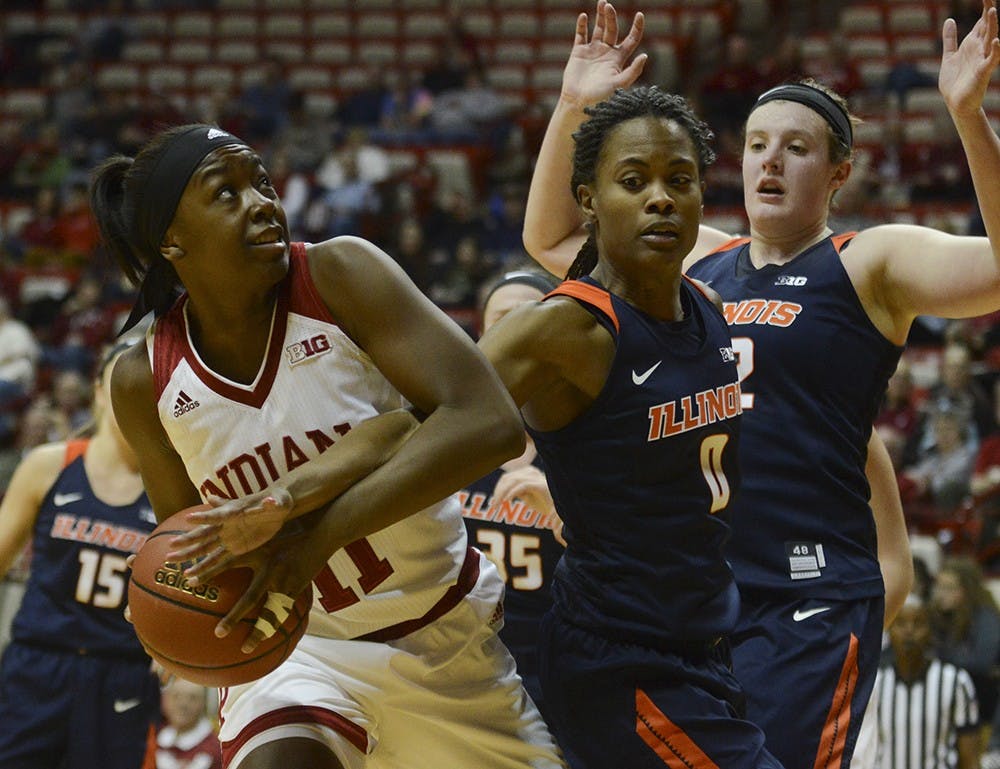 Freshman forward Kym Royster fights for possession during the game against Illinois on Wednesday at Assembly Hall.