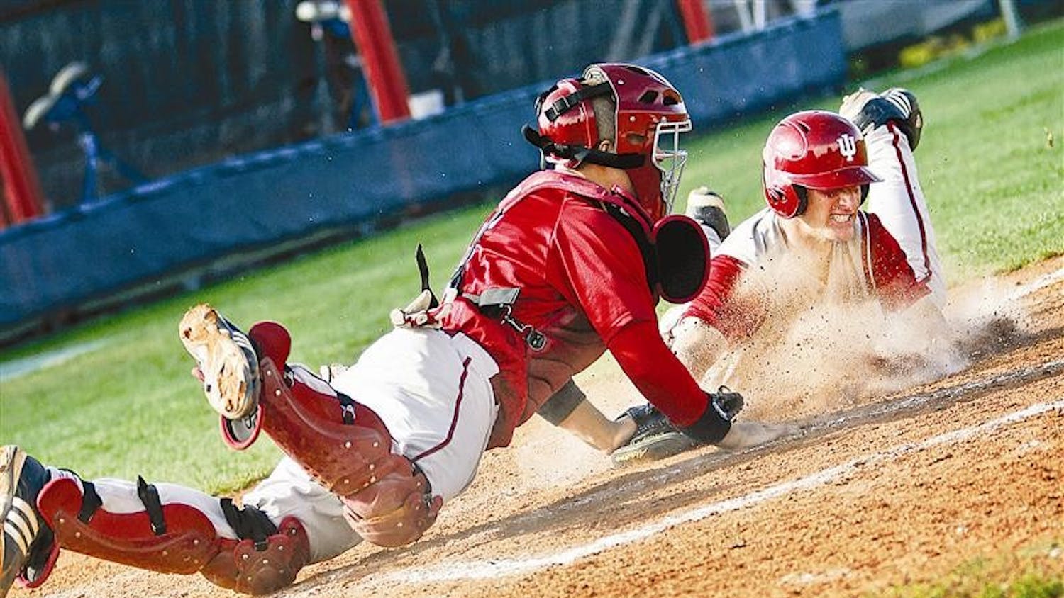 Sophomore catcher Wes Wilson makes an unsuccessful attempt at tagging freshman infielder Brian Ritz during game one of the Cream & Crimson World Series on Wednesday afternoon at Sembower Field. The Cream squad beat Crimson 6-2.