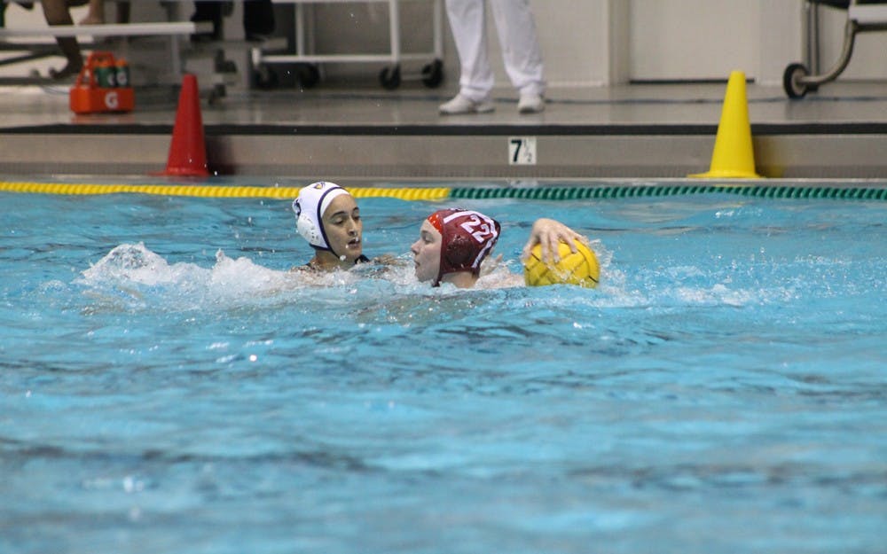 IU junior Sarah Young defends the ball from Califorina Baptist University during the first quarter of Saturday evening's match. Young scored five goals to help the Hoosiers defeat the Lancers 13-6.