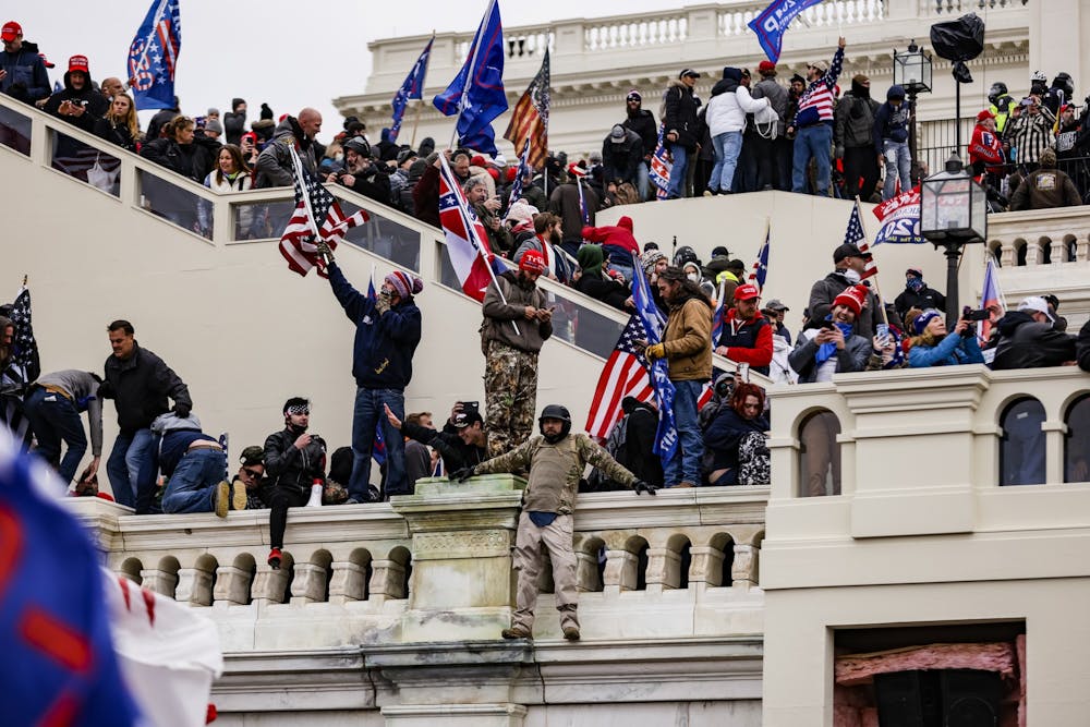<p>Pro-Trump supporters storm the U.S. Capitol following a rally with President Donald Trump on Wednesday, Jan. 6, 2021, in Washington, D.C. </p>