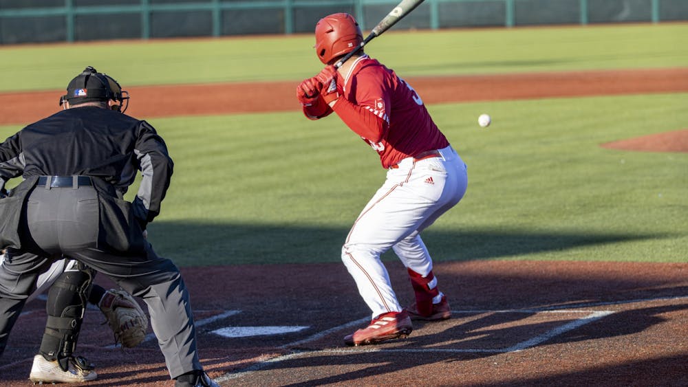 Redshirt junior catcher Matthew Ellis watches a pitch come in during a game against Purdue Fort Wayne on March 9, 2022, at Bart Kaufman Field. Indiana left 26 total runners stranded on base in its three losses to Rutgers over the weekend.