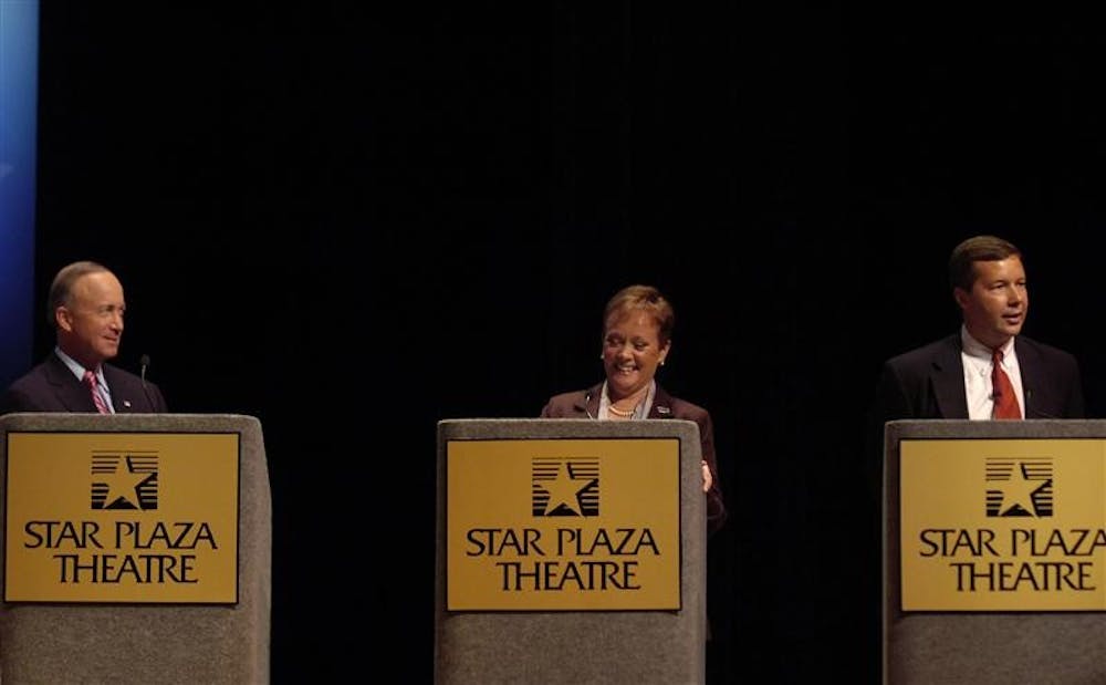 Indiana Gov. Mitch Daniels, left, and libertarian candidate Andy Horning, right, listen to comments by democratic candidate Jill Long Thompson during the Indiana Gubenatorial Debate on Tuesday at the Star Plaza Theater in Merrillville, Ind.