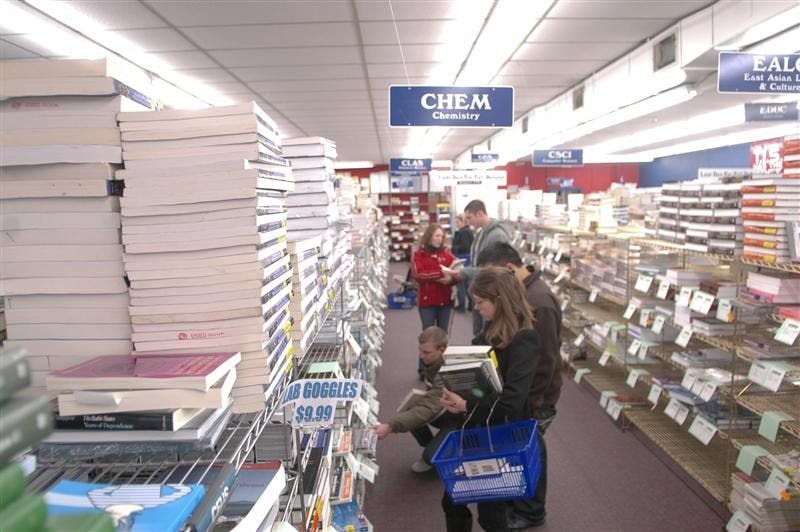 Students purchase textbooks Monday afternoon at T.I.S. Bookstore. Students have been forced to purchase used textbooks or find alternative online means to keep down the rising cost of reading materials for their classes. 