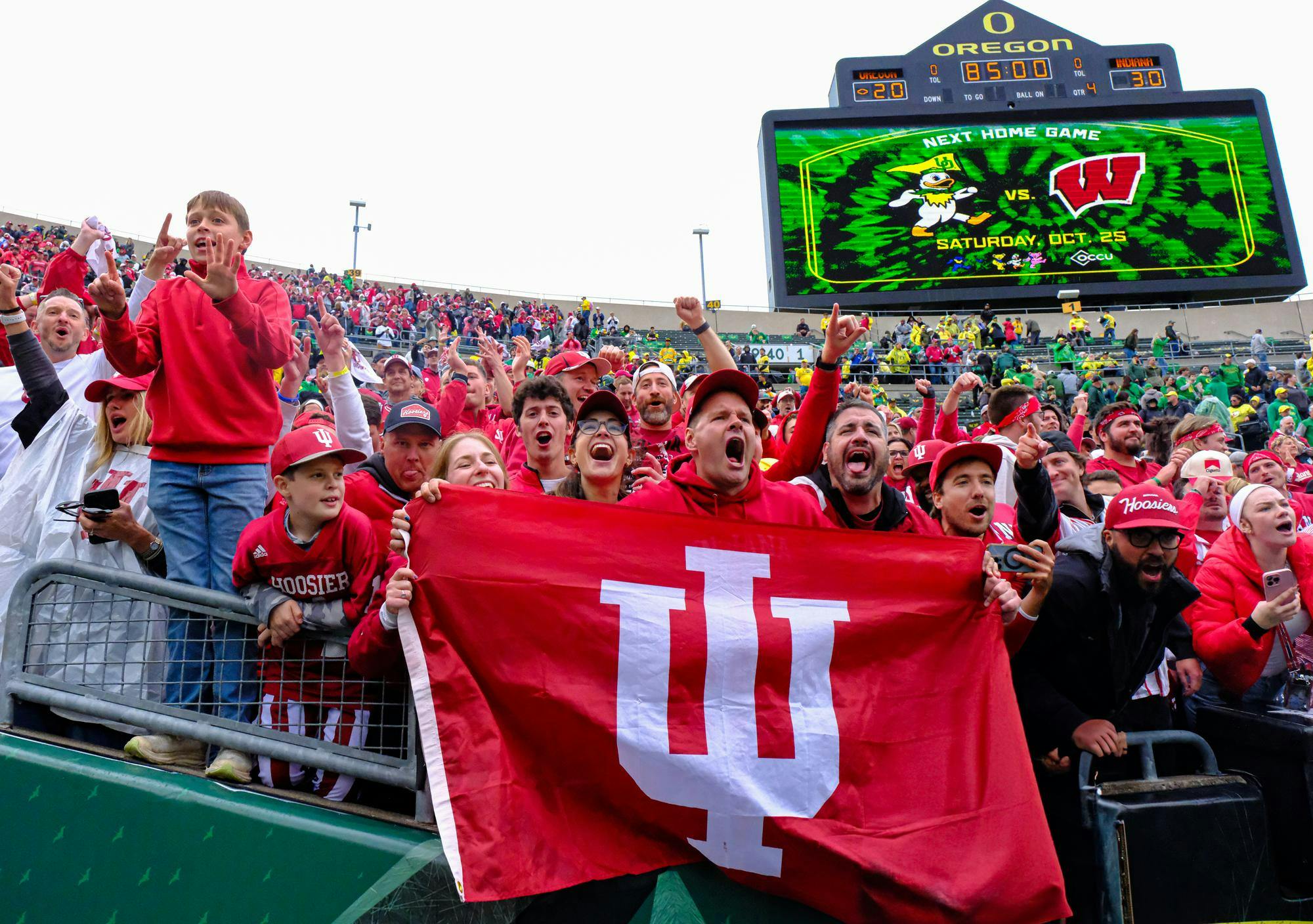  fans shout during the final moments of IU versus Oregon at Autzen Stadium on Oct. 11 in Eugene, Oregon. Fans flooded to the front rows of the stands in the final minutes of the fourth quarter. 