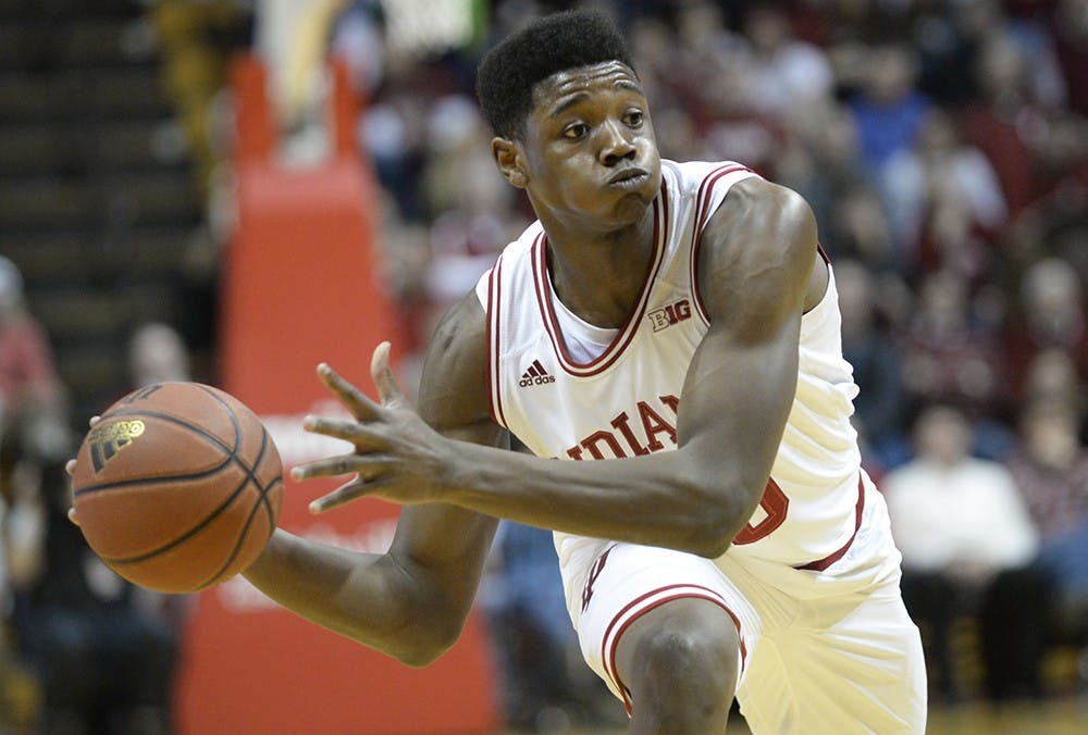 Freshman Emmitt Holt looks to pass to a teammate during IU's game against Penn State on Tuesday at Assembly Hall.