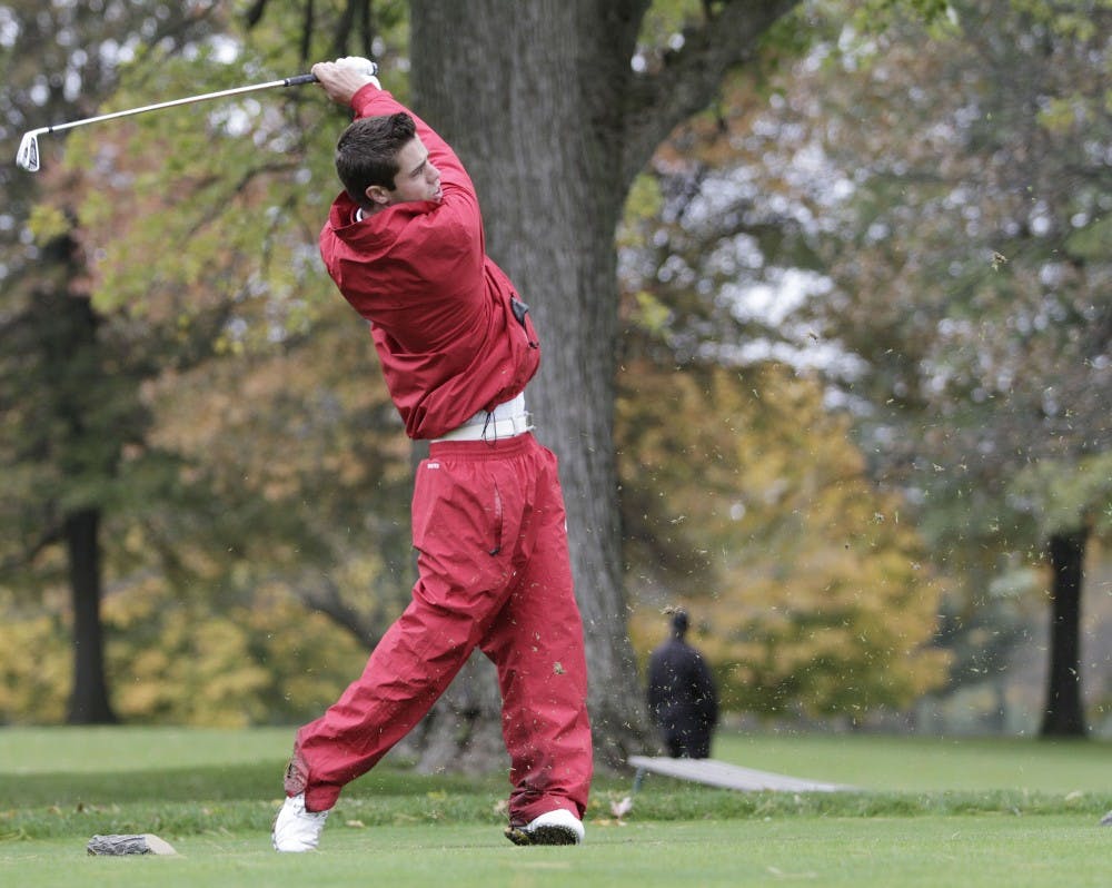 <p>Then-freshman Max Kollin, now a PGA golfer, tracks the flight of his tee shot on the par-3 eighth hole at the Delaware Country Club during the Earl Yestingsmeier Invitational on Nov. 15, 2012. IU will compete in the Bighorn Collegiate March 23-24 in Palm Desert, California.&nbsp;</p>