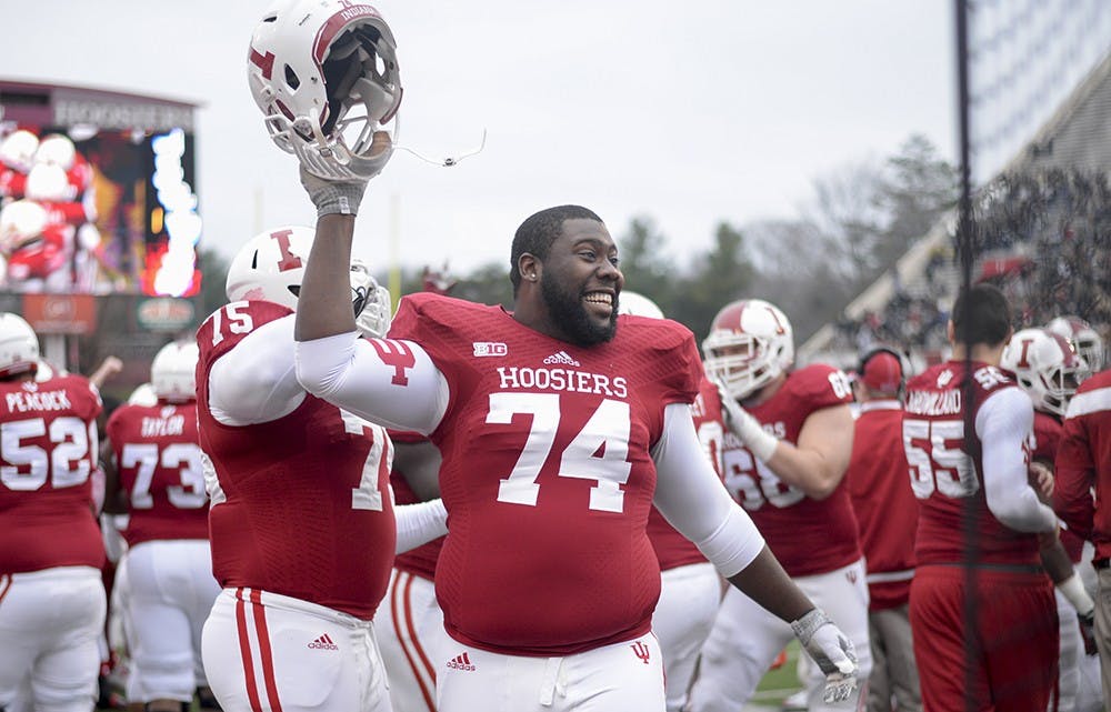 Junior offensive lineman DeAndre Herron celebrates from the sidelines as freshman quarterback Zander Diamont scores the game-winning touchdown of IU's game against Purdue on Saturday at Memorial Stadium.