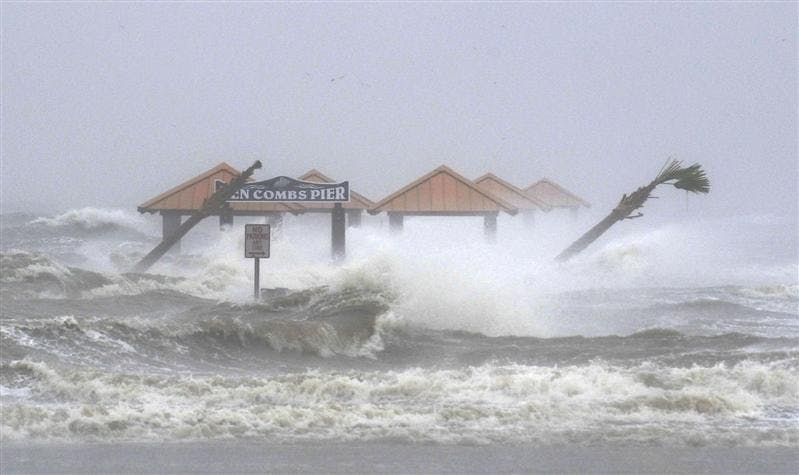 Waves generated by the storm surge from Hurricane Gustav crash over the newly-rebuilt Ken Combs Pier on Monday in Gulfport, Miss. 
