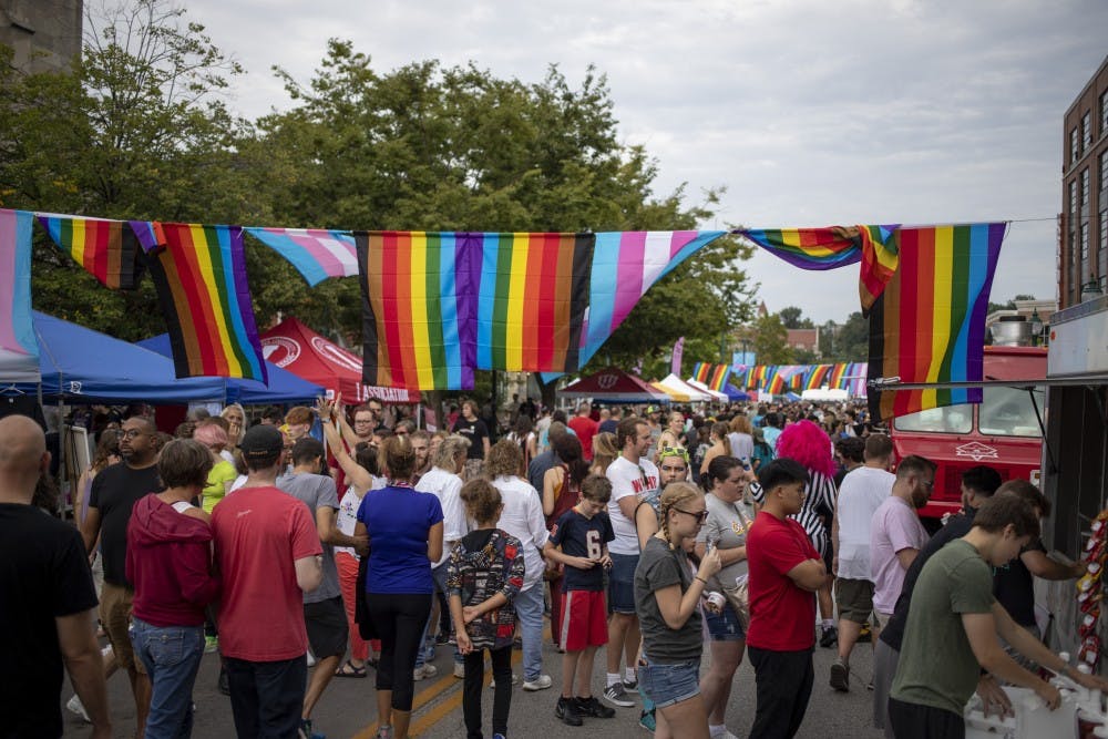 <p>The Bloomington Pridefest attendees wander around Aug. 31 on East Kirkwood Avenue. Pridefest offered many booths with food, clothes and awareness to different organizations.&nbsp;</p>