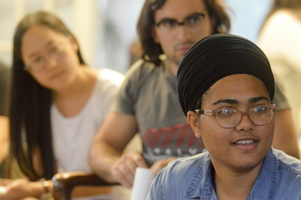 Harsharn Kaur, a freshman studying Political Science and Sociology, speaks on her own personal experiences as an immigrant from Punjab, India during the DreamIU callout meeting Tuesday evening at the Latino Cultural Center. William Palomo hosted the event and aims to serve the needs of undocumented students at Indiana University and in the Bloomington Community. 