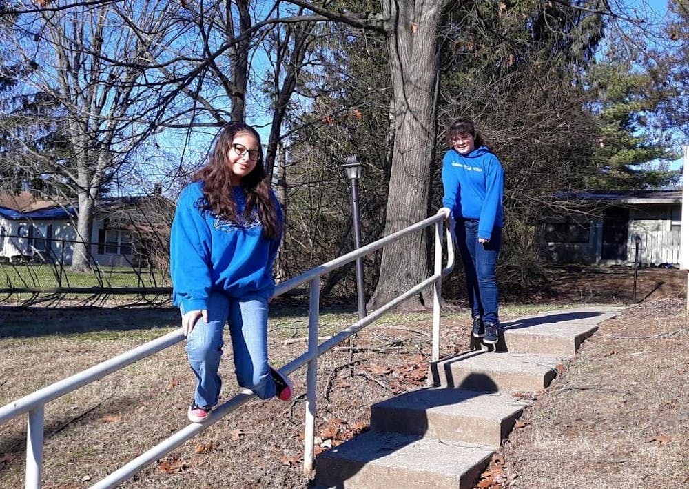 <p>Micah White&#x27;s daughters, seventh grader Acacia Galvan and ninth grader Micheala Galvan, pose for a photo. The Monroe County Community School Corporation announced Bloomington High School North and South will have hybrid weeks of half in-person and online classes.</p>