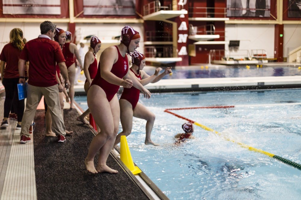 Freshman Riley Beemer leaps into the pool, preparing to face UC Santa Barbara on Jan. 29. IU won against four out of four schools during the Santa Clara invite Feb. 24 and 25.