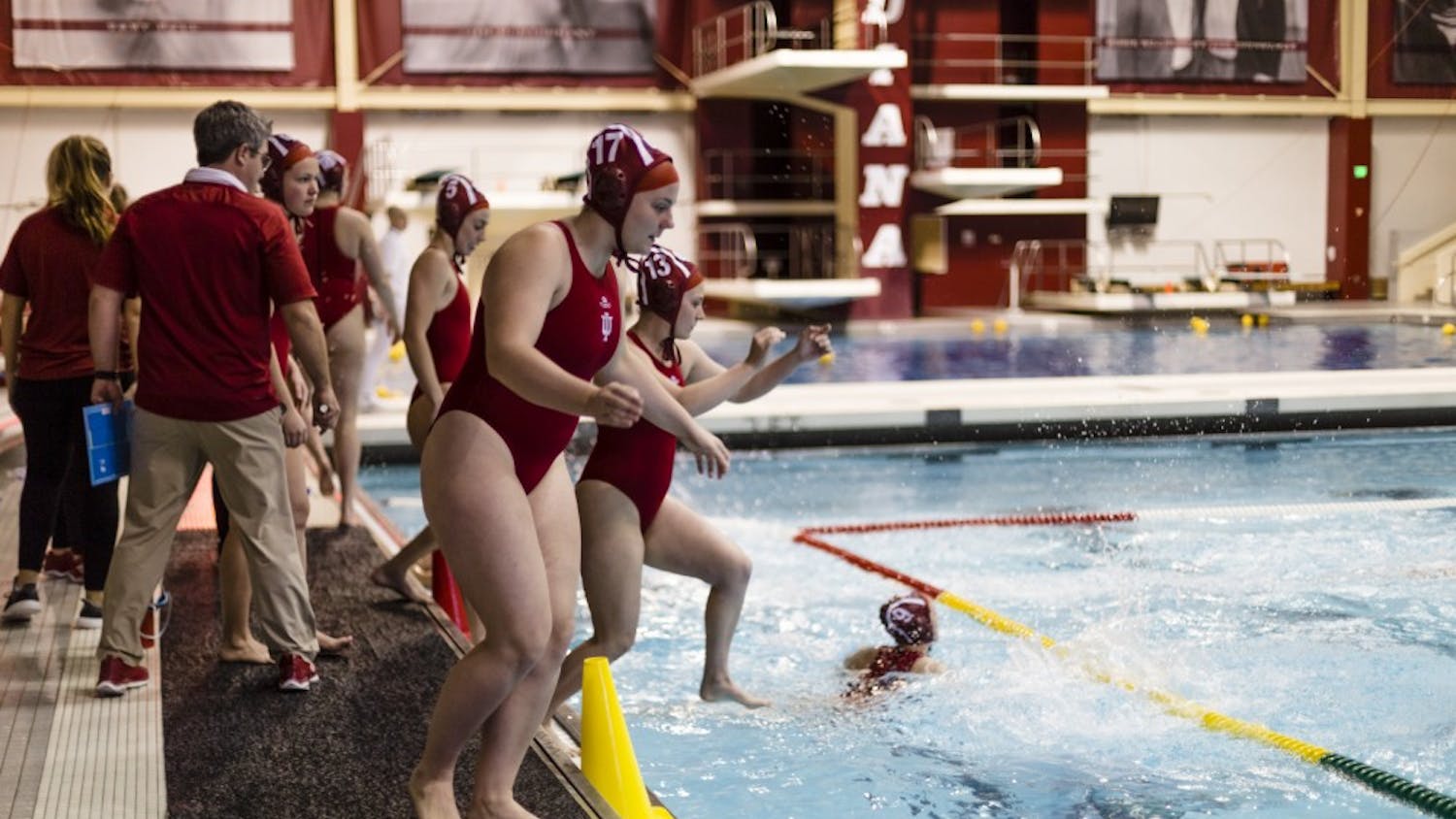 Freshman Riley Beemer leaps into the pool, preparing to face UC Santa Barbara on Jan. 29. IU won against four out of four schools during the Santa Clara invite Feb. 24 and 25.