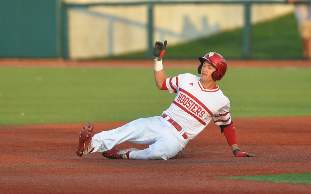 Matt Gorski slides in to second base after his double scores Indiana’s fourth run of the game on Wednesday at Bart Kaufman Field. Indiana ultimately lost to Butler 7-5.