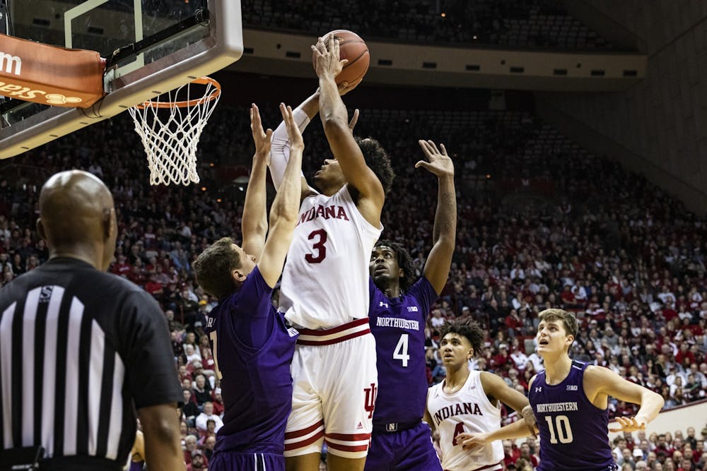 <p>Junior forward Justin Smith goes up for a shot in the second half against Northwestern on Jan. 8 in Simon Skjodt Assembly Hall. Smith scored 18 of IU’s 66 points to win the game.</p>