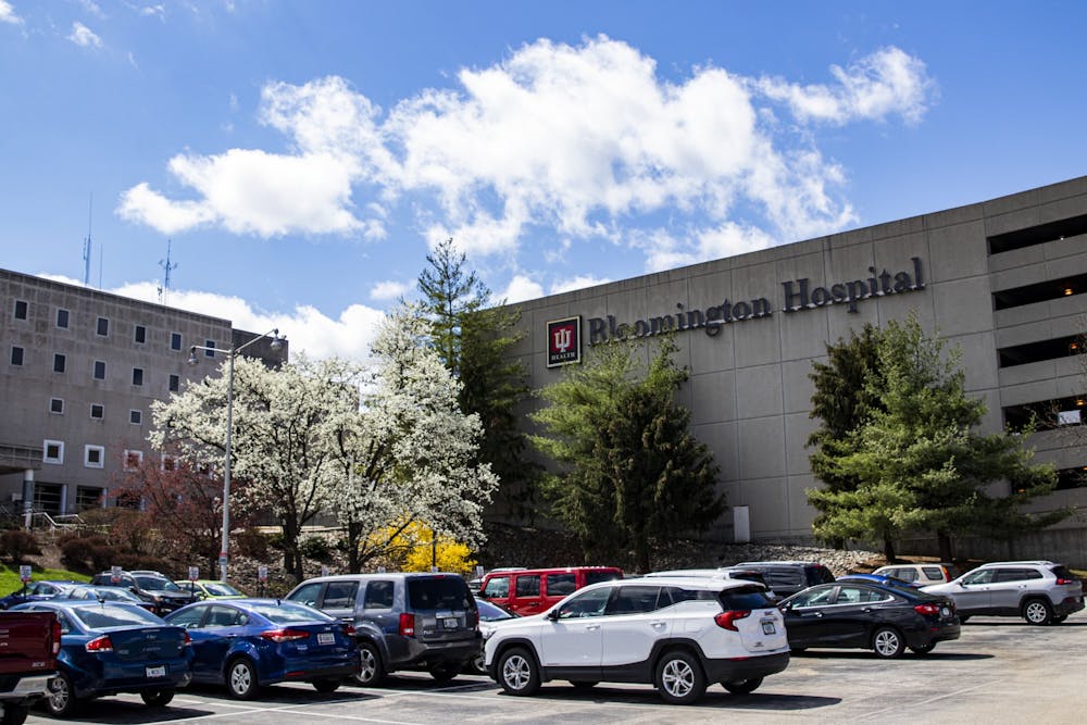 <p>Cars sit parked in the patient parking lot March 29, at IU Health Bloomington Hospital. As of June 9, according to Indiana’s COVID-19 Dashboard, there are 38,033 total cases of COVID-19 in the state.</p>