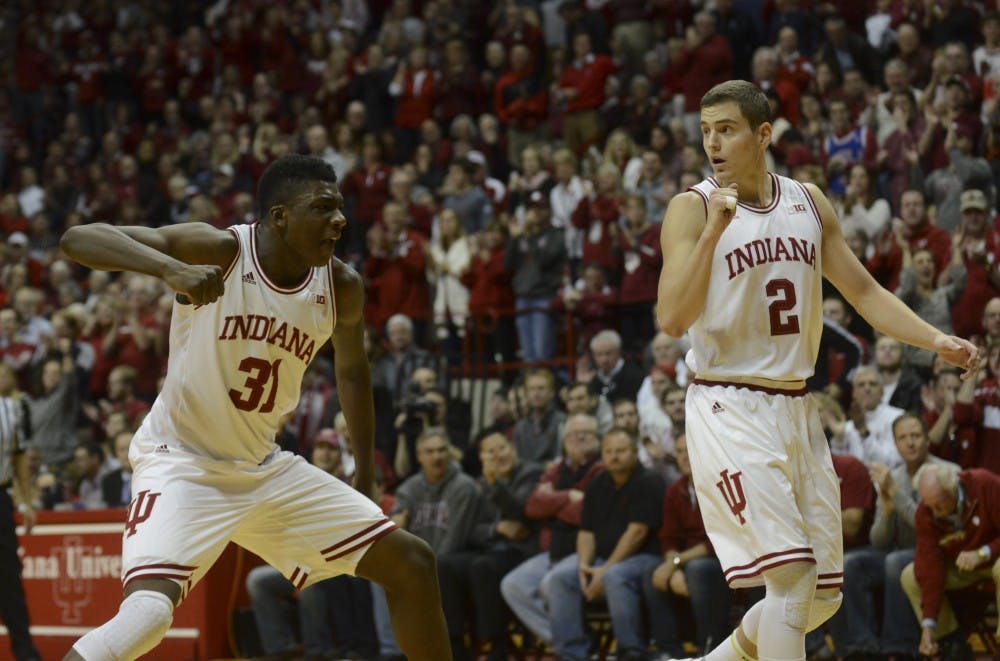 Freshman center Thomas Bryant (31) and redshirt senior Nick Zeisloft (2) celebrate during the game against Wisconsin on Jan. 5 at Assembly Hall. The Hoosiers won, 59-58.