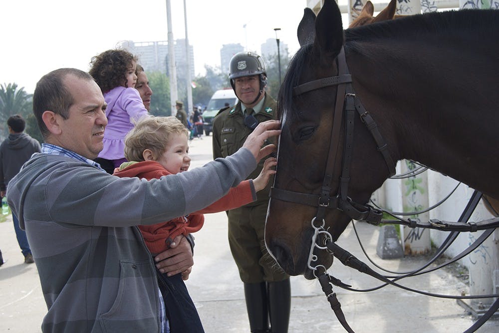 Carabineros, Chilean police, and their horses rigorously patrolled the event, but also catered to younger members of the crowd.