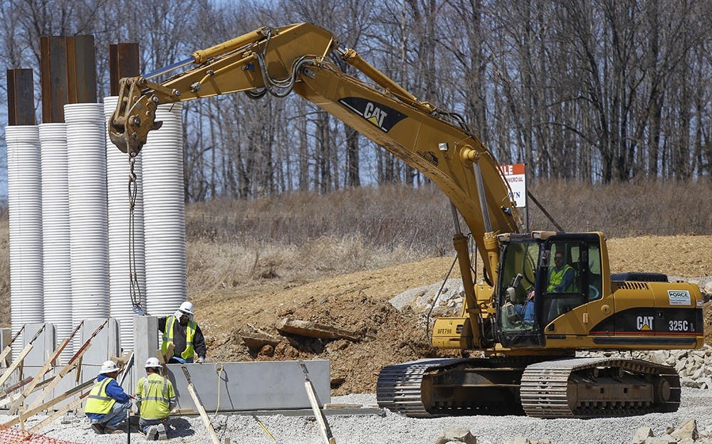 Workers build supports as a part of a project to expand the exisitng State Road 37 in Morgan and Monroe counties to interstate Tuesday at State Road, I-69, Section 5 in Monroe County. The expansion will be expected to be finished on Oct. 2016. 