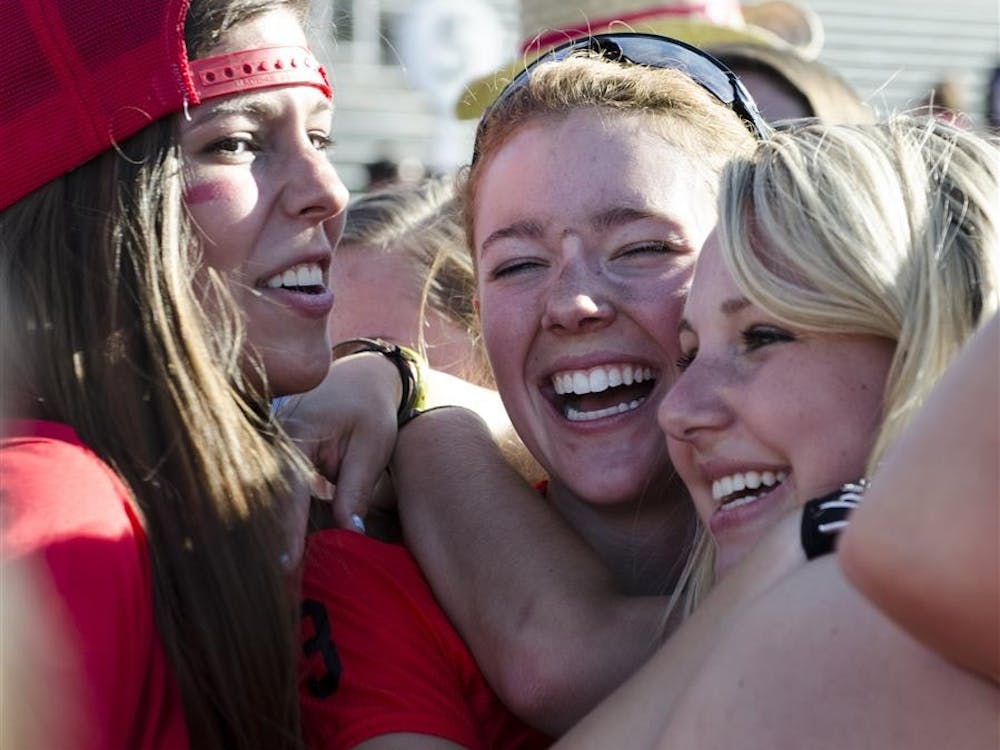Abby Rogers of Kappa Alpha Theta is surrounded by friends and supporters after her team took first place in the Little 500 women's race Friday at Bill Armstrong Stadium. Kappa Alpha Theta won with a time of 1:13:11.425.

