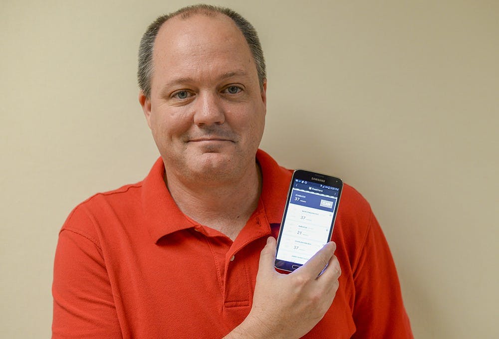 App designer Chris Borland is creating a new app to drive consumer traffic to Bloomington's downtown area.