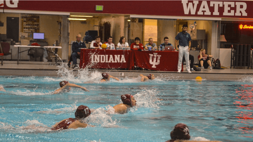 Members of the women’s water polo team swim to the center of the court to start the quarter March 7, 2020, in the Counsilman-Billingsley Aquatics Center. The Hoosiers beat Saint Francis 16-2 on Saturday at the Counsilman-Billingsley Aquatics Center.