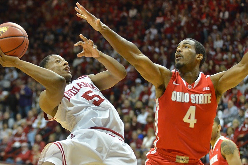 Junior guard Troy Williams leans back to shoot over an Ohio State defender on Sunday at Assembly Hall. The Hoosiers won 85-60.