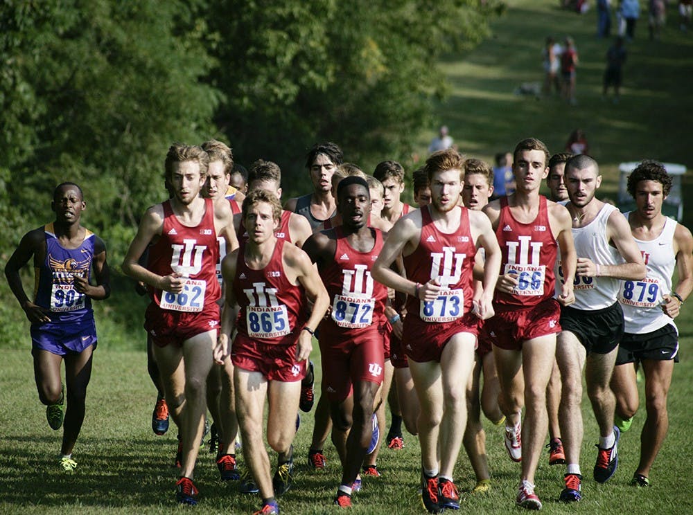 Members of the men's cross country team run up a hill during the Indiana Open on Sept. 5. Both the men's and women's teams won by large margins and allowed the runners to compete for the first time this season.