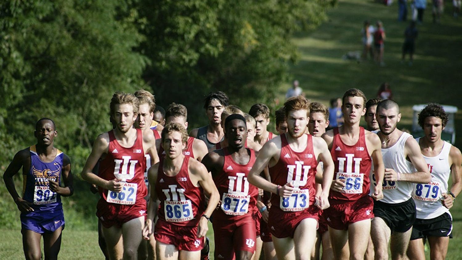 Members of the men's cross country team run up a hill during the Indiana Open on Sept. 5. Both the men's and women's teams won by large margins and allowed the runners to compete for the first time this season.