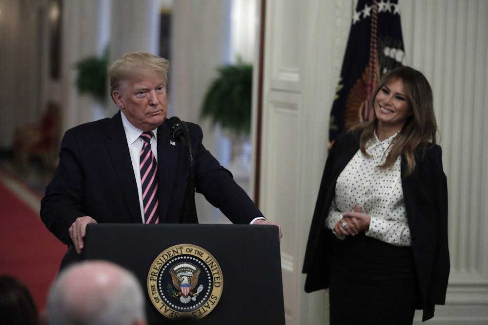 <p>President Donald Trump stands next to first lady Melania Trump on Feb. 6 after his remarks about his Senate impeachment trial in the East Room of the White House.</p>